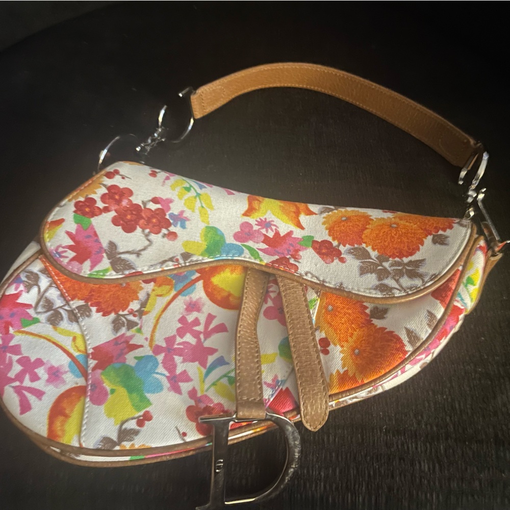 Exquisite vintage Dior Floral canvas and leather saddlebag.